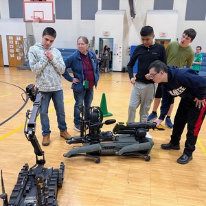 Cape May County Special Services School District students interacting with New Jersey State Police robot dogs.